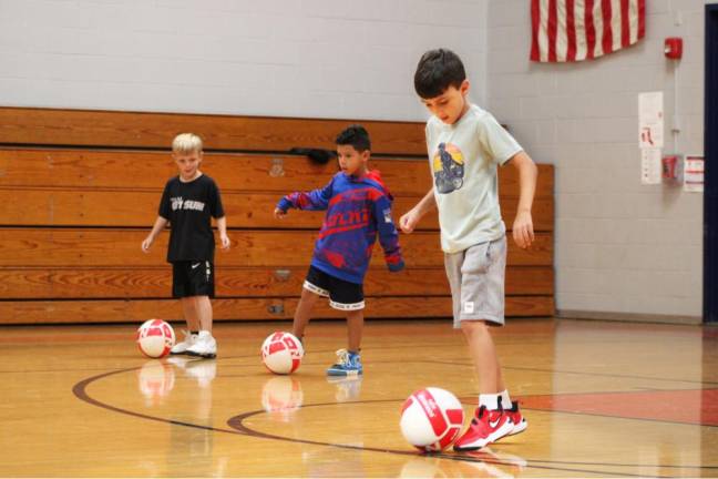 Students practice their foot work during the Physical Education Enrichment class.