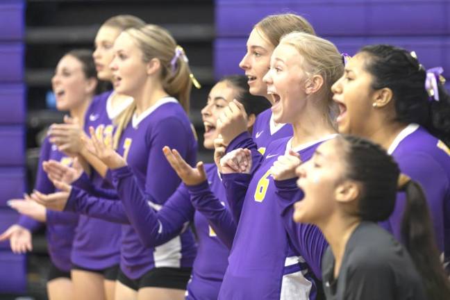 The team cheers on during the Sept. 7 girls volleyball match.