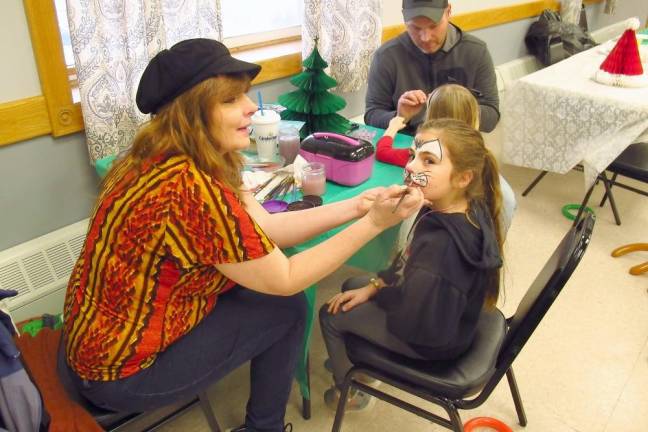 Santa and elf make merry at American Legion