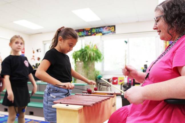 The Music Enrichment class is focusing on the xylophone.