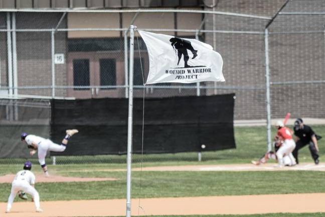 The Wounded Warrior flag flies over the campus as baseball teams compete on Saturday, April 27.