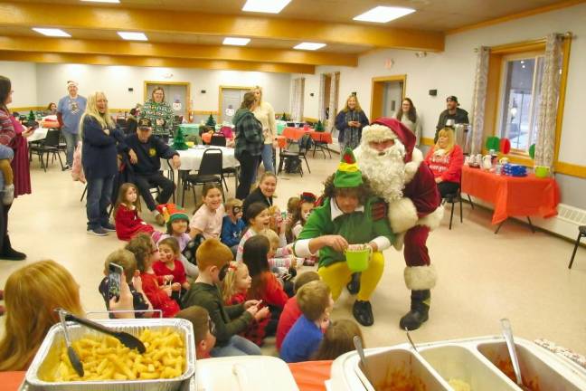 Santa and elf make merry at American Legion