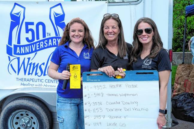 Winslow’s senior staff members Nikki Ferro, Susan Ferro, and Stacy Lenz pose for a photo after announcing the winners of the 33rd Annual Duck Derby on May 19.