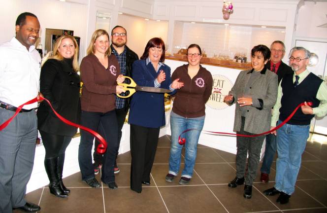 Photo by Roger Gavan Public officials and members of the Warwick Valley Chamber of Commerce join Abigail Stever and Melissa Schultz and their guests for the official grand opening of the new location of Eat Sweet Bakery. Front from left, Cedric Glasper, president of the Warwick Valley Chamber of Commerce; Interior Designer Caitlin Burck; Abigail Stever and her husband, Travis; Assemblywoman Annie Rabbitt; Melissa Schultz; Chamber Vice President Sherry Bukovcan; Executive Director Michael Johndrow; and Mayor Michael Newhard.