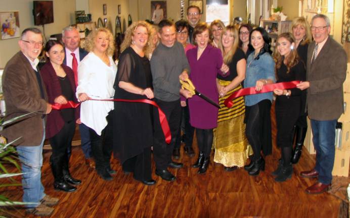 Photo by Roger Gavan On Friday, April 8, Town of Warwick Supervisor Michael Sweeton (far left) and members of the Warwick Valley Chamber of Commerce joined Sal Viola (center) and his staff at a ribbon-cutting ceremony to celebrate Soho Salon's fourth location, at 11 First St.