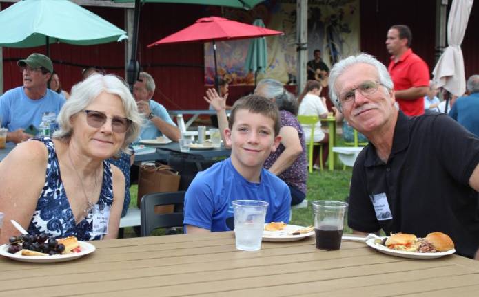 The Perciballis of Lafayette, NJ with their grandson, after a day giving tours of their garden. The Perciballis are past winners of the tour.