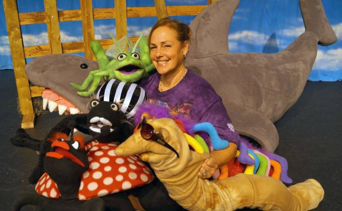 Yvonne Bel-Blatt shares a moment with the puppets she created to populate the Acting Out Playhouse musical production of Roald Dahl's &quot;James and the Giant Peach Jr.&quot; at SUNY Orange. She also created the costumes for the play.