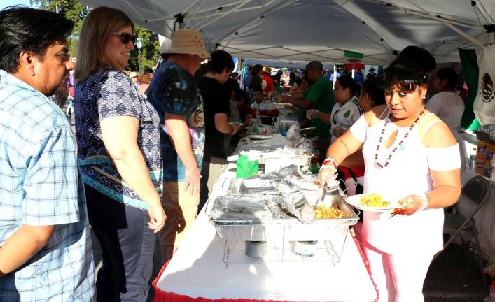 After arriving at Railroad Green and throughout the evening everyone was invited to sample the free food tastings of cuisine from Honduras, Guatemala, Mexico, the Dominican Republic, Puerto Rico, and El Salvador.