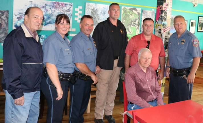 Standing from left, among those attending the &quot;Coffee with a Cop&quot; event were: Town of Warwick Councilman Floyd DeAngelo, Warwick Police Officer Amie McBrady, Lt. John Rader, Detective Mike Hoffman, State Assemblyman Karl Brabenec and Lt. Tom Maslanka; and seated: retired Warwick Police Sgt. George Arnott.