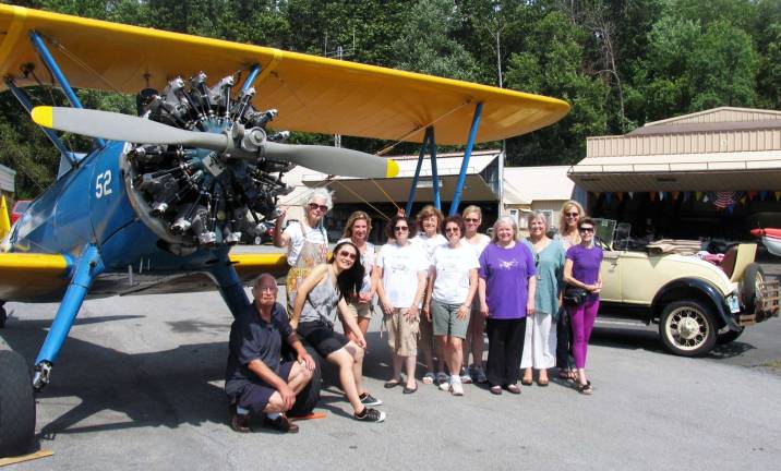 Photo by Roger Gavan Members of the North Jersey Chapter of the &#xec;Ninety Nines,&#xee; an International organization of women pilots, pose with Warwick Municipal Airport Manager Dave MacMillan.