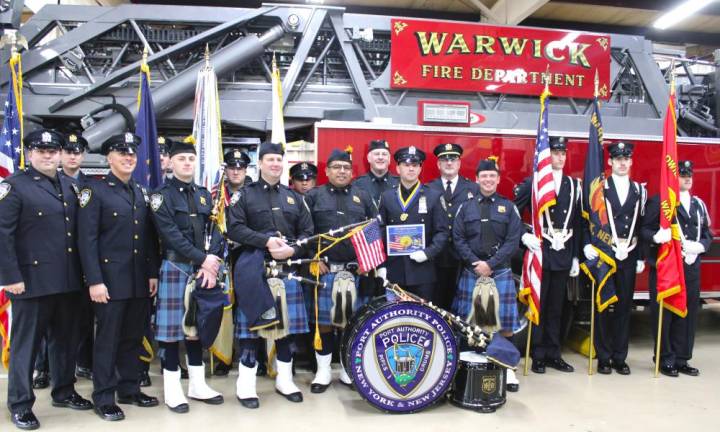 Kevin Colomba stands alongside PAPD and the Warwick Fire Department Color Gaurd.