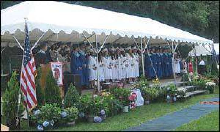 Members of Seward's Class of 2011 'Walk this Way' following graduation ceremonies