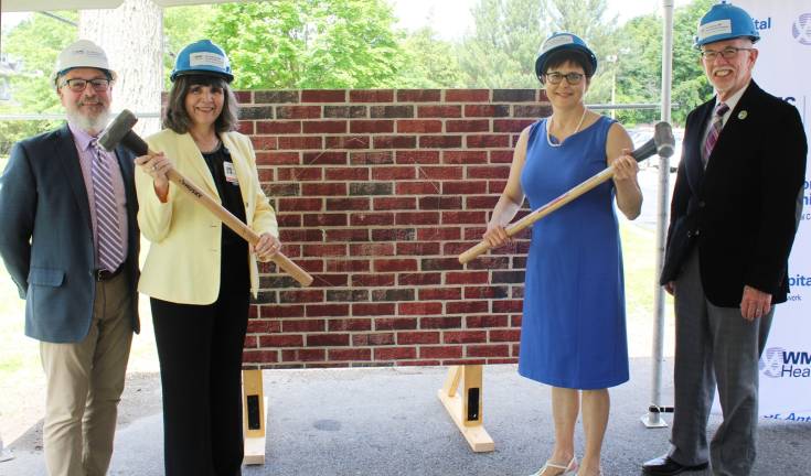 Provided photos Mary Leahy, MD, CEO, Bon Secours Charity Health System (left), and Mary Juliano, chair of the Bon Secours Warwick Foundation Board, smash the ceremonial wall to kick off construction of the St. Anthony Community Hospital Radiology Department expansion. Warwick Mayor Michael Newhard (left) and Warwick Town Supervisor Michael Sweeton lend their support.