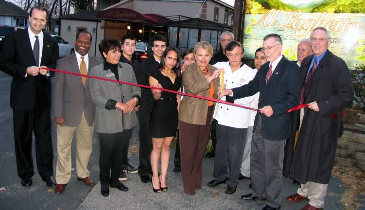 Photo by Roger Gavan On Nov. 15, Town of Warwick Supervisor Michael Sweeton, Greenwood Lake Mayor Barbara Moore and members of the Warwick Valley Chamber of Commerce joined owner/chef Tony Kolaj, his partner Jessica Stillman, friends and staff members for the grand reopening of their restaurant, Al Laghetto.