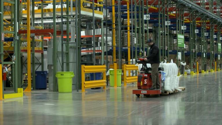 Workers at the Medline warehouse in Montgomery, N.Y., which fulfills 50,000 orders a day, mostly headed to hospitals.