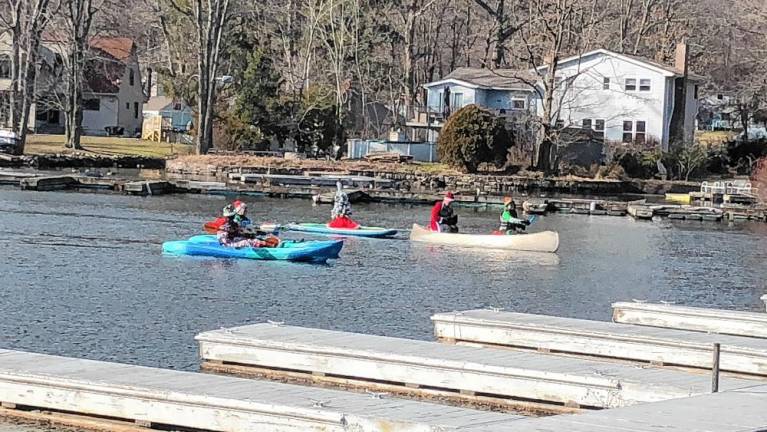 Santapalooza participants move up the east arm of Greenwood Lake.