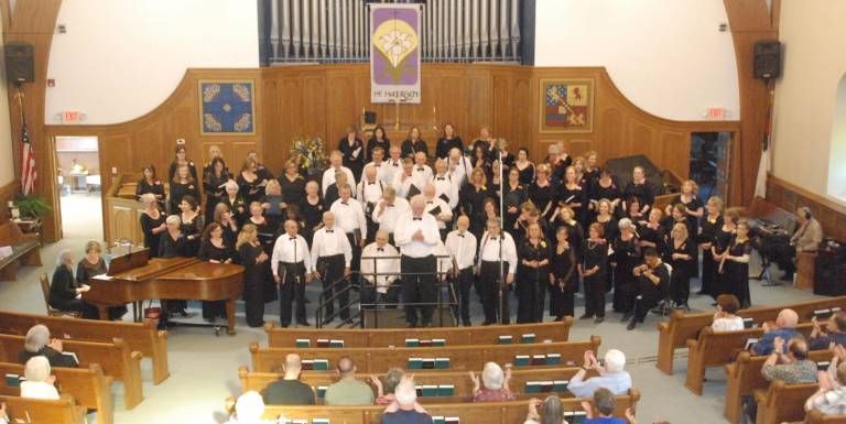 Photos by Ed Bailey Conductor Stanley Curtis takes a bow following the Warwick Valley Chorale's concert last Sunday, May 19, at the Warwick Reformed Church.