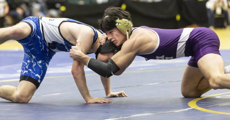 Warwick wrestlers compete in the first day of the Section 9 championship tournament at Monroe-Woodbury High School on Feb. 14.