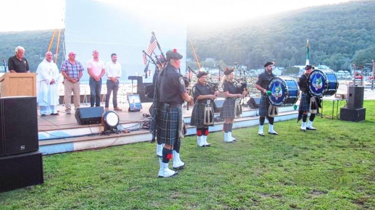 The Orange County AOH Pipe Band plays during Irish Night at the beach.